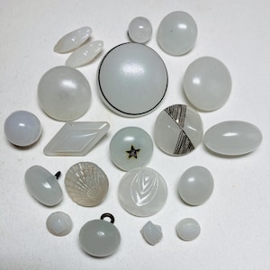 May include: A set of three ceramic nesting bowls in shades of blue, green, and white. The bowls feature a speckled glaze and a simple, modern design. The largest bowl is approximately 6 inches in diameter.