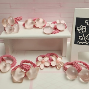 Pair of mini tiny pink hair bobbles 2cm bands for babies small girls. 7 designs to choose from.