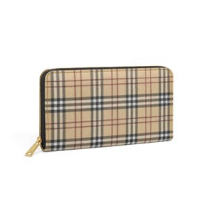 May include: A beige and plaid zip-around wallet with a gold-toned zipper pull. The wallet features a classic plaid pattern in beige, black, and red. The wallet is rectangular in shape.