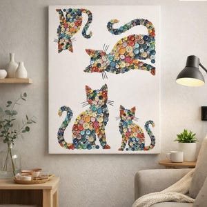 May include: A rectangular wall art canvas featuring four cats created from a mosaic of multicolored sewing buttons. The artwork displays one cat leaping, one cat sitting, and two smaller cats, all arranged on a plain white background.