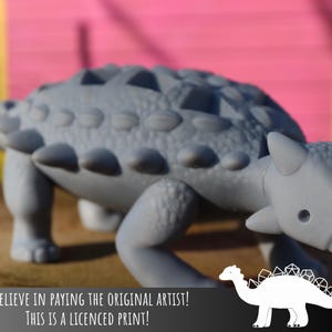 Angus the Ankylosaurus Dice holding Dinosaur - Awesome DND accessory - Perfect gift for your DM - Licensed from RachMakes