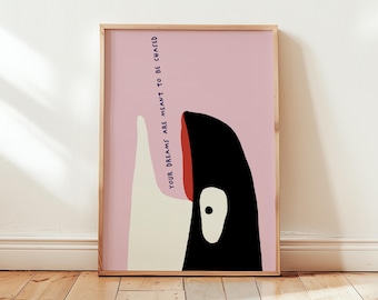 May include: A pink and white framed print with a black and white illustration of a whale's head. The text "YOUR DREAMS ARE MEANT TO BE CHASED" is written vertically on the left side of the whale's head.