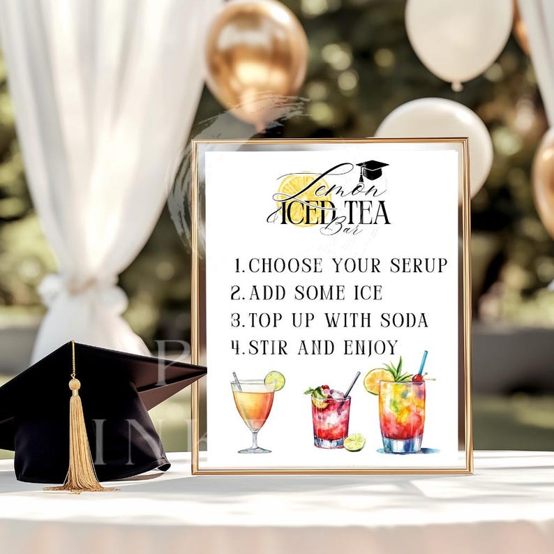 May include: A framed sign for a Lemon Iced Tea Bar with instructions and illustrations of cocktails. The sign includes a graduation cap graphic and the text "Lemon Iced Tea Bar". A graduation cap with a gold tassel is on the left.