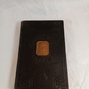 May include: A rustic wooden sign with the text "Welcome to our home" in white lettering. The sign features a distressed finish and a simple, inviting design, perfect for entryway decor.