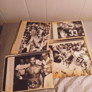 May include: A collection of black and white vintage photographs featuring sports figures. The photos show a boxer with a championship belt, a football player in action, and a football player celebrating a touchdown.