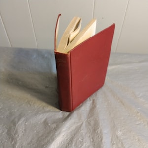 May include: A red hardcover book with the title "Tales from the...