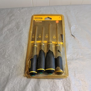 May include: A package of five Stanley ProDriver screwdrivers with yellow and black handles. The screwdrivers are packaged in a clear plastic blister pack with a yellow and black header card.