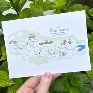 May include: A white postcard featuring a map of the River Thames, from source to sea. The map is in green and light blue, with illustrations of landmarks and the text "River Thames". The distance is noted as 345 km / 220 miles.