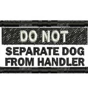 May include: Embroidered patch with the text "DO NOT SEPARATE DOG FROM HANDLER" in white lettering on a black and white background. The patch has a rectangular shape with a black border.
