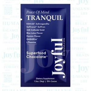 May include: A dark blue packet of "Tranquil" superfood chocolate. The packet lists ingredients like KSM-66 Ashwagandha, saffron, and 24K colloidal gold. It is a dietary supplement, 1.3 oz (36g), 75% cacao, with the website humans.com.