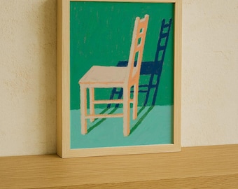 May include: A framed art print depicting a chair in pastel colours against a green and blue backdrop. The chair is light orange, with a dark blue shadow. The artwork is in a light wood frame, creating a minimalist aesthetic.