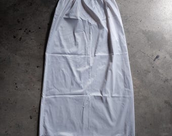 1960s Komar nylon half slip with slit