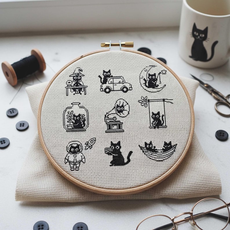 This fantasy cross-stitch pattern features a hobbit-style cottage illustrated across all four seasons, each framed within a decorative postage stamp border. Spring blooms with soft flowers and gentle sunlight, summer glows with lush greenery, autumn warms the scene with golden leaves, and winter settles into a peaceful snowfall beneath a glowing moon. The rounded door, grassy roof, and winding path tie each scene together, creating a cohesive yet varied seasonal collection.