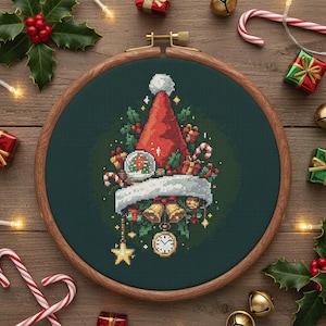 May include: A cross-stitch design of a Santa hat filled with Christmas ornaments, candy canes, and a snow globe. The design is set in a wooden embroidery hoop, with holly and Christmas decorations around the frame.