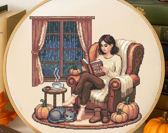 Patrón de punto de cruz de niña otoñal leyendo en un cómodo sillón. Mujer tranquila leyendo junto a la ventana. Bordado. Punto de cruz perfecto para amantes de los libros.