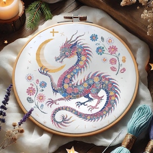 Majestic Floral Dragon Cross-Stitch Pattern – Instant Download
This exquisite dragon cross-stitch pattern blends fantasy and floral elements, featuring a beautifully detailed mythical dragon coiled around a glowing crescent moon. Perfect for embroidery lovers who enjoy celestial and magical designs, this PDF pattern is a must-have for creative projects.