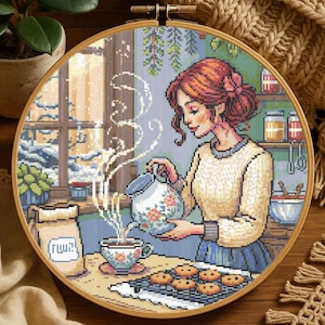 居心地の良い冬のキッチンシーンと女性のクロスステッチパターン、クッキーと紅茶を作る女性、刺繍パターン、ホリデーウィンタークロスステッチPDF