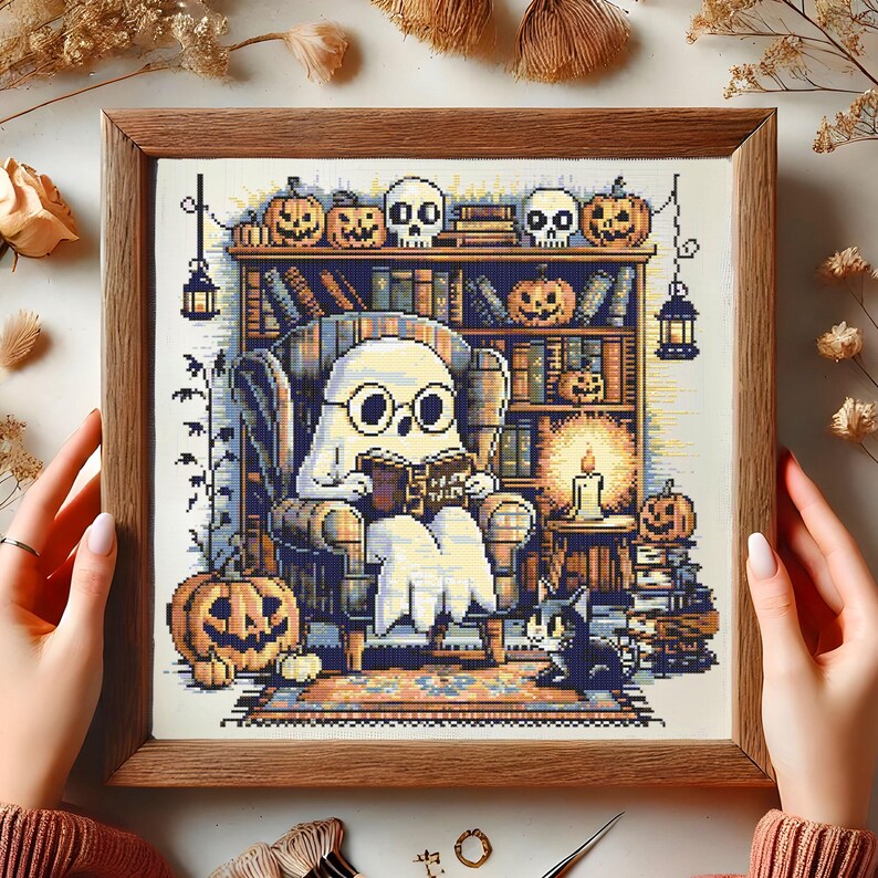 Ghost Reading in Haunted Library Cross-Stitch Pattern – Cozy Ghost with Glasses in Armchair Surrounded by Books, Pumpkins, Skulls and Candles for Halloween Decor
This charming Halloween cross-stitch design features a sweet ghost nestled in an armchair reading Ghost Tales. The cozy haunted library setting is rich with spooky details – pumpkins grin from bookshelves, skulls rest on top of ancient tomes, and glowing candles light the room. A curious cat peers up from below