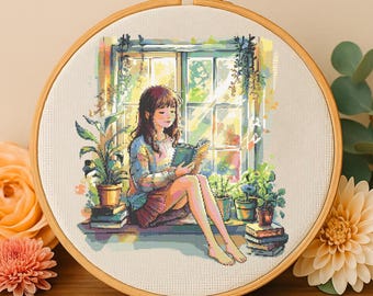 May include: Cross-stitch embroidery of a girl sitting by a window reading a book. The girl has long brown hair and is wearing a light blue sweater and a pink skirt. The window is open and there are plants on the windowsill. The scene is set in a room with a light beige wall.