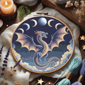 Mystical Lunar Dragon Embroidery Chart – DIY Fantasy Needlework
Immerse yourself in a world of cosmic wonder with this stunning celestial dragon embroidery pattern. With intricate shading, glowing moon phases, and a powerful dragon silhouette, this PDF cross-stitch chart is ideal for fantasy-inspired stitching and unique home decor.