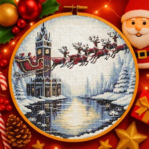 May include: A cross-stitch embroidery in a wooden hoop depicts Santa's sleigh pulled by reindeer over a snowy landscape with a clock tower. The scene is set against a wintery backdrop with a reflective lake. Christmas-themed decor surrounds the hoop.