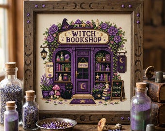 May include: A cross-stitch embroidery of a storefront labeled WITCH BOOKSHOP, featuring purple tones, a black cat, books, and floral accents, framed in dark wood with moon phases carved into the border, displayed with glass jars of lavender.