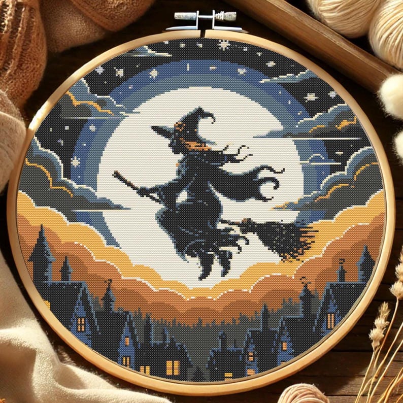 Flying Witch Halloween Cross-Stitch Pattern – Broomstick Witch Soaring Over Haunted Town with Full Moon
This atmospheric pattern features a bold silhouette of a witch flying on her broomstick across a glowing full moon, surrounded by layered twilight clouds and a starry sky. Below, dark rooftops and pointed turrets create a charmingly spooky village, perfect for Halloween decor and seasonal stitching.