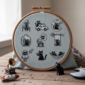 This fantasy cross-stitch pattern features a hobbit-style cottage illustrated across all four seasons, each framed within a decorative postage stamp border. Spring blooms with soft flowers and gentle sunlight, summer glows with lush greenery, autumn warms the scene with golden leaves, and winter settles into a peaceful snowfall beneath a glowing moon. The rounded door, grassy roof, and winding path tie each scene together, creating a cohesive yet varied seasonal collection.