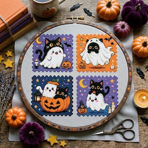 May include: A circular wooden embroidery hoop containing a cross-stitch pattern of four square panels featuring black cats and ghosts in Halloween costumes. The design includes pumpkins, candles, stars, and moons on a light gray fabric background.