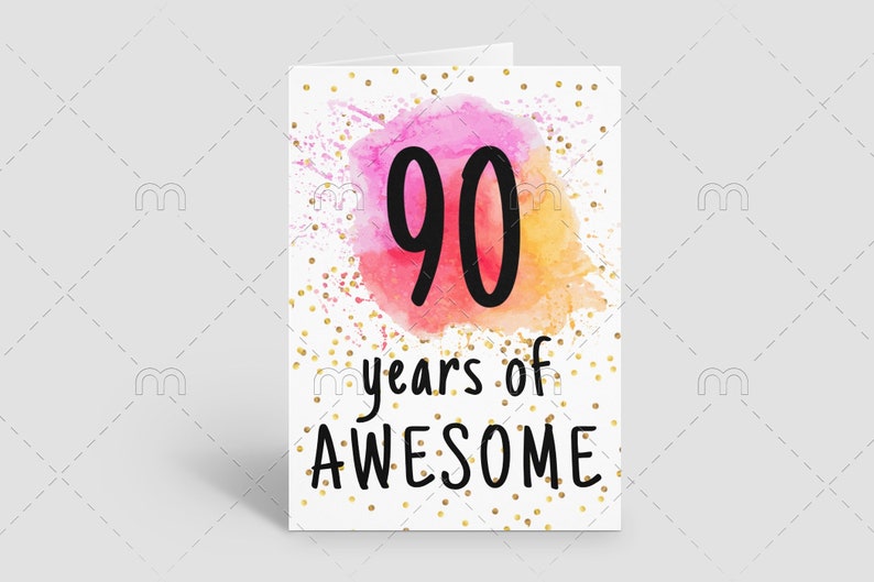 May include: A white card with gold glitter confetti and a pink and orange watercolor background. The number 90 is written in black in the center of the card. The text "years of AWESOME" is written in black below the number.
