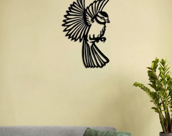 May include: Black metal wall decor featuring a stylized silhouette of a bird with its wings spread. The bird is in flight and has a detailed design.