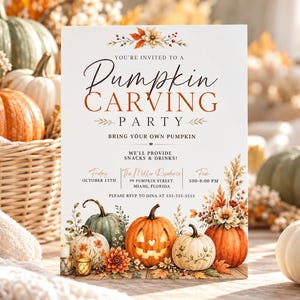 May include: A white rectangular invitation card for a Pumpkin Carving Party. The text reads: You're invited to a Pumpkin Carving Party, bring your own pumpkin, we'll provide snacks and drinks, Friday October 15th, The Miller Residence, 99 Pumpkin Street, Miami, Florida, 5:00-8:00 PM, please RSVP to Dina at 555-555-5555. The card features illustrations of pumpkins and autumn flowers.