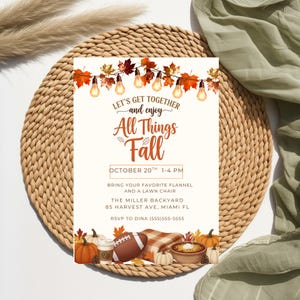 May include: An invitation with the text "Let's Get Together and Enjoy All Things Fall." The invitation includes fall-themed graphics like pumpkins, a football, and autumn leaves. The event is scheduled for October 20th, 1-4 PM.