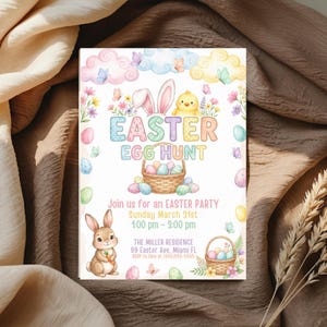 May include: An Easter Egg Hunt invitation with pastel colors. The design features a bunny, chick, eggs, and a basket. The text reads "Easter Egg Hunt" and includes party details: date, time, and location.