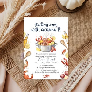 May include: A baby shower invitation with the text "Boiling over with excitement!" features a watercolor illustration of a seafood boil. The invitation includes event details for Tara and Joseph's baby shower, including the date, time, and location.
