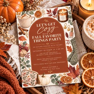 May include: A rectangular party invitation card with a central dark orange arch containing the text LET'S GET COZY WITH A FALL FAVORITE THINGS PARTY. The border features illustrations of pumpkins, dried orange slices, cinnamon sticks, a mug, a gift, earrings, nail polish, socks, and autumn leaves.