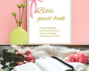 May include: A framed sign with a pink watercolor bow and gold text reading Bible guest book. Below the title, the text reads: Please highlight your favorite verse, write a message, and sign your name. An open Bible is displayed below.
