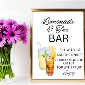 May include: A framed sign with the text Lemonade & Tea BAR, featuring illustrations of a glass of lemonade and a glass of iced tea with a lemon slice, mint, and a striped straw, plus instructions: FILL WITH ICE, ADD THE SYRUP, POUR LEMONADE OR TEA, TOP WITH FRUIT, Enjoy.
