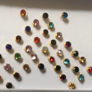Stones face body decor, look an enchanting Princess. Approx 36 dots to give s look of royalty or bollywood actor, made with Swarovski stone
