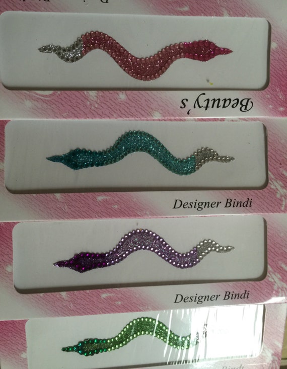 Glittery Body snakes drsigned by our french designers amazing look crawl an ankle or back belly wherever decor