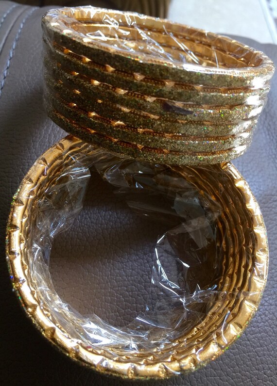 Gold glitter broad bangles 48 pcs 2 dzs for each hand size 2.10 ie 2 inches and 10/16 inches diameter metal better