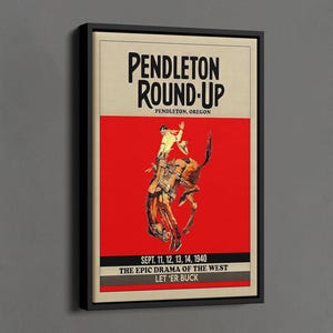 May include: Black framed canvas print of a vintage Pendleton Round-Up poster. The poster features a cowboy riding a bucking bronco against a red background. Text includes "PENDLETON ROUND-UP" and "LET 'ER BUCK".