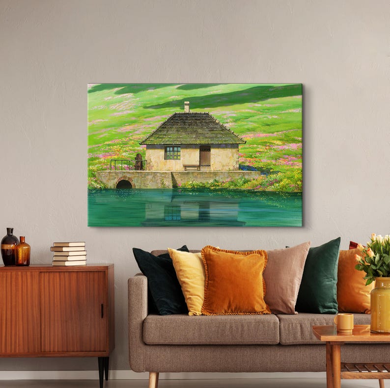 May include: A painting of a small, brown, wooden house with a thatched roof, sitting on a grassy hill next to a body of water. The house has a single window and a door. The water is a bright blue and reflects the sky and the house.