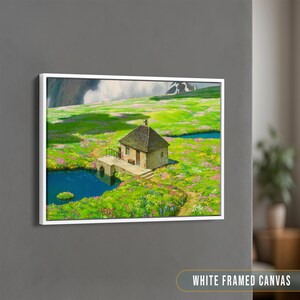 May include: A white framed canvas print of a small stone house with a green roof, surrounded by a field of wildflowers and a small pond. The house is nestled in a valley with mountains in the background.