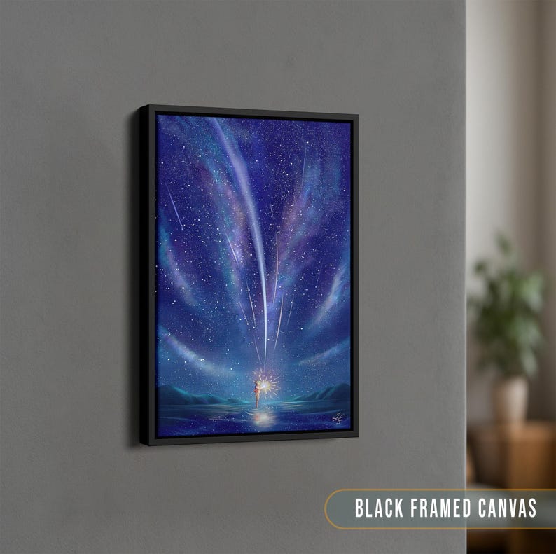 May include: A black framed canvas print of a starry night sky with a single figure standing in the water, looking up at the sky. The sky is filled with shooting stars and a bright, glowing light.