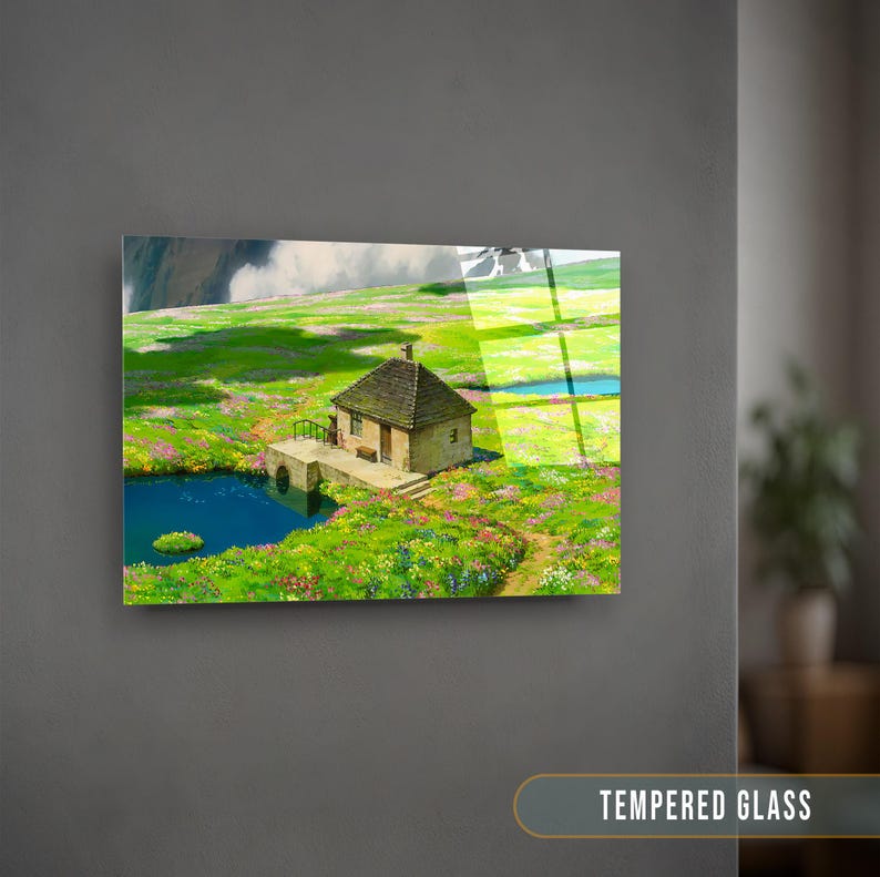 May include: A small, stone house with a green roof sits on a grassy hill with a pond in the foreground. The house has a small porch and a window on the side. The grass is green and lush, and there are flowers scattered throughout the scene.