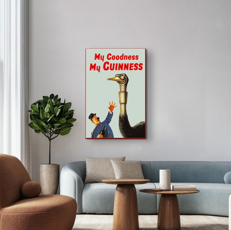 May include: A vintage advertisement for Guinness beer featuring a man in a blue uniform holding a bottle of Guinness and an ostrich with the text "My Goodness My Guinness".