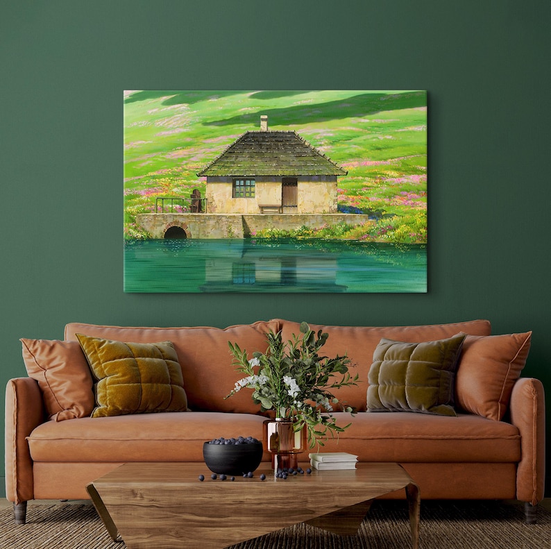 May include: A painting of a small, stone cottage with a thatched roof, situated on a grassy hill overlooking a still body of water. The cottage has a single window and a wooden door. The water reflects the sky and the surrounding landscape.