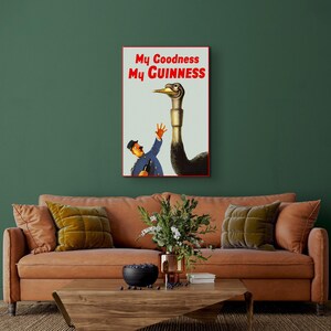 May include: Vintage Guinness advertisement featuring a cartoon man reaching out to a large ostrich with the text "My Goodness My GUINNESS".