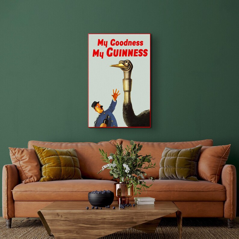 May include: Vintage Guinness advertisement featuring a cartoon man reaching out to a large ostrich with the text "My Goodness My GUINNESS".